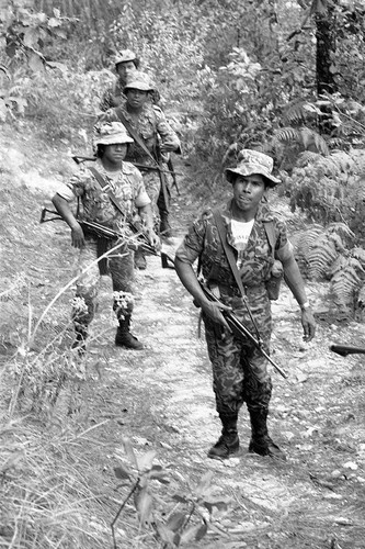 Four soldiers on patrol, Guatemala, 1982