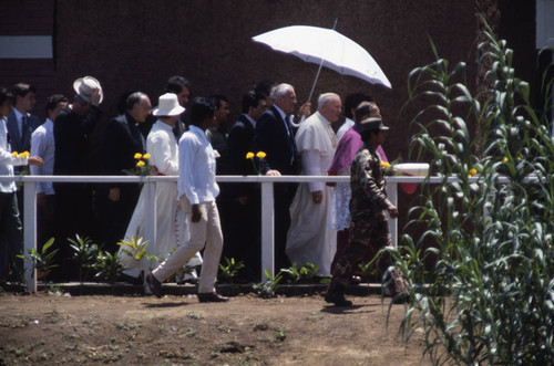 Pope John Paul II is shielded from the sun, Managua, Nicaragua, 1983