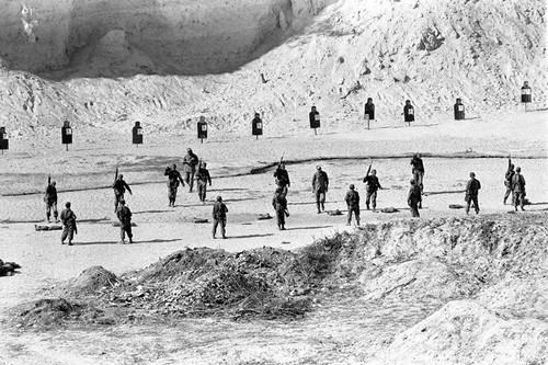 U.S. advisors training Salvadoran soldiers at a shooting range, Ilopango, 1983