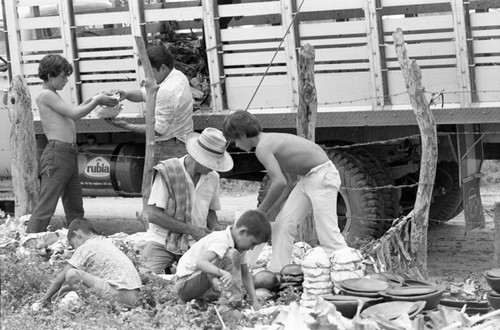 Wrapping clay pieces, La Chamba, Colombia, 1975