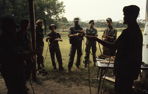 Survival school students tie rope, Liberal, 1982