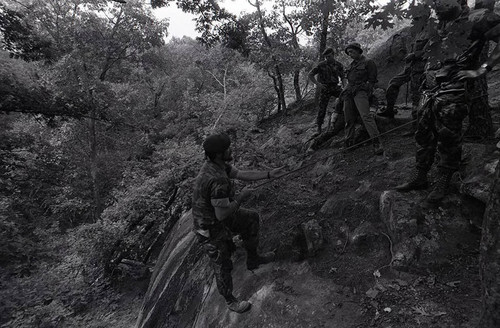 Claflin demonstrates rappelling, Liberal, 1982