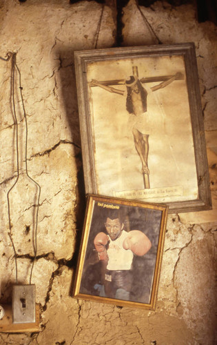 Pictures hanging from an interior wall, San Basilio de Palenque, 1976