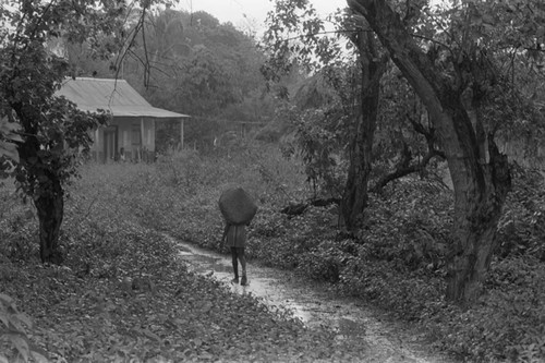 Girl walking on a trail, San Basilio de Palenque, 1976