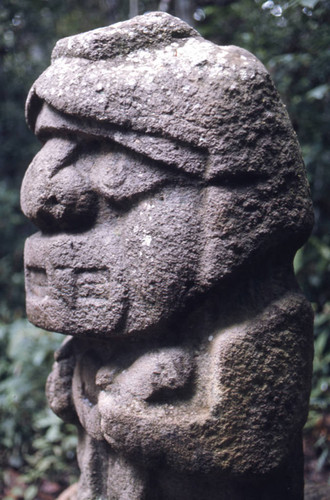 Stone statue, figure holding a snake, San Agustín, Colombia, 1975