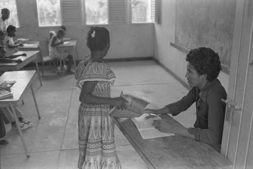 Teacher working with student, San Basilio del Palenque, ca. 1978