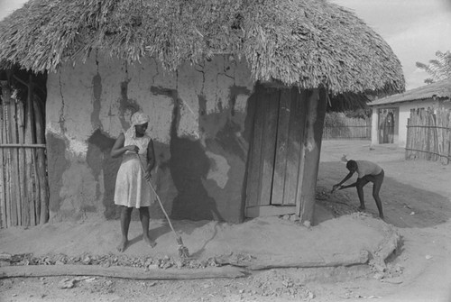 Woman sweeping the floor, San Basilio de Palenque, 1976