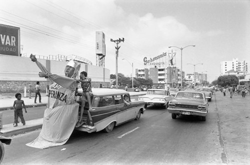 Giant figure traveling on a car, Barranquilla, Colombia, 1977