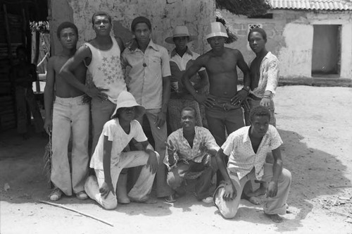 Young men sitting in front of building, San Basilio de Palenque, 1975