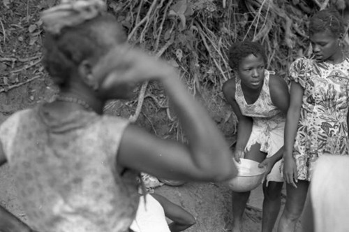 Women collect water at river, San Basilio de Palenque, 1975