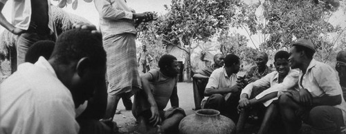 Men gathering outdoors, Tanzania, 1979