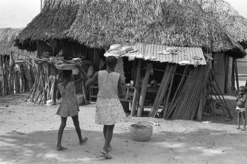 Girl carrying fish, San Basilio de Palenque, 1975