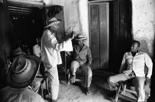 Men gather, San Basilio de Palenque, Colombia, 1977