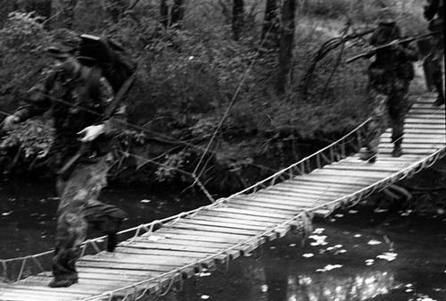 Survival school students cross a bridge, Liberal, 1982