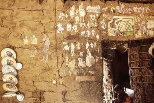 Boxing photographs hanging from a wall, San Basilio de Palenque, 1976