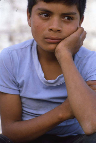 Mayan boy rests his chin on his hand, Chajul, 1982