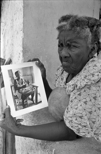 Woman holding a portrait, San Basilio de Palenque, 1977