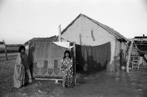 Wayuu women near houses, La Guajira, Colombia, 1976