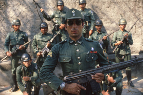 National guardsmen posing with rifles, Suchitoto, Cuscatlán, El Salvador, 1981