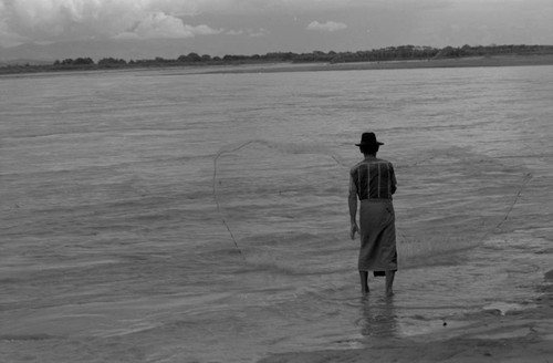 Fisherman casting a net, La Chamba, Colombia, 1975