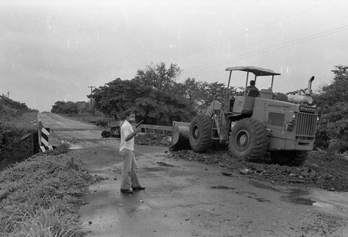 Sandinista stands near a bridge, Nicaragua, 1979