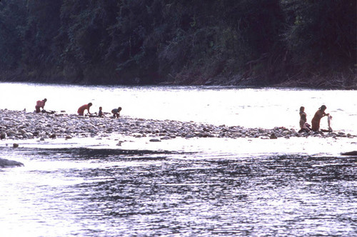 Guatemalan refugees washing at a river, Ixcán, ca. 1983