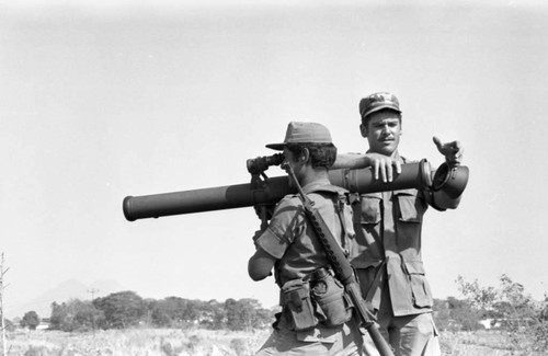 A U.S. military advisor training a Salvadoran soldier at Ilopango Military Base, Ilopango, 1983