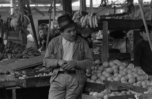 A man at the market, Tunjuelito, Colombia, 1977