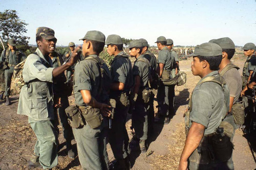 U.S. advisor speaks to a Salvadoran cadet, Ilopango, San Salvador, 1983