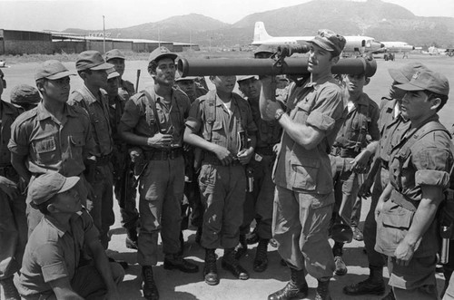 A U.S. military advisor trains Salvadoran soldiers at Ilopango Military Base, Ilopango, 1983