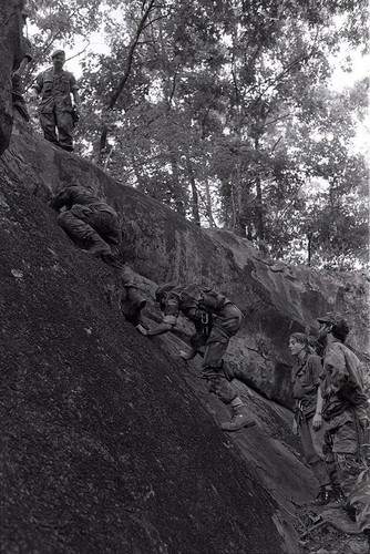 Survival school students learn to rock climb, Liberal, 1982