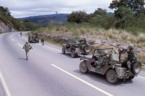 Armed soldiers in jeeps patrol the roads, Guatemala, 1982