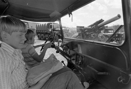 Boys in military truck, Pipestone County Fair, Minnesota, 1972