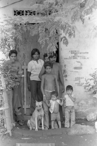 People near a boarded doorway, Nicaragua, 1979