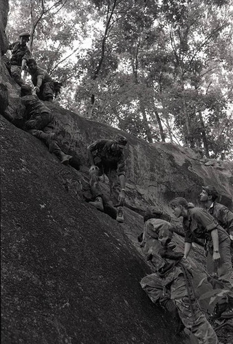 Survival school students learn to rock climb, Liberal, 1982