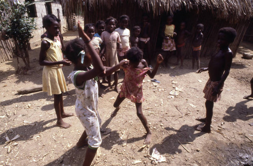 Girls boxing outdoors, San Basilio de Palenque, 1976