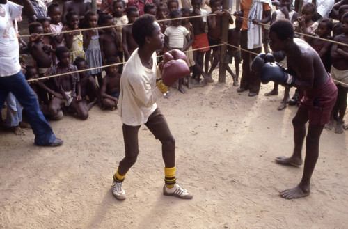 Men boxing inside boxing ring, San Basilio de Palenque, 1976