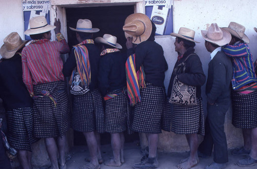 Mayan men standing in line to vote, Nahualá, 1982