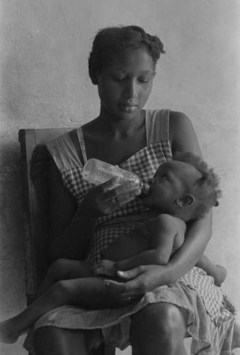 Woman feeding a baby, San Basilio de Palenque, 1976