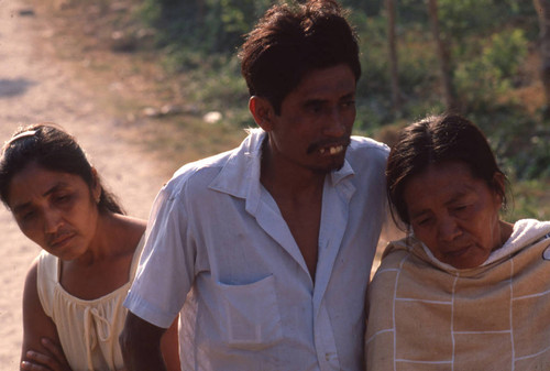 People viewing a dead body, Apopa, San Salvador, El Salvador, 1981