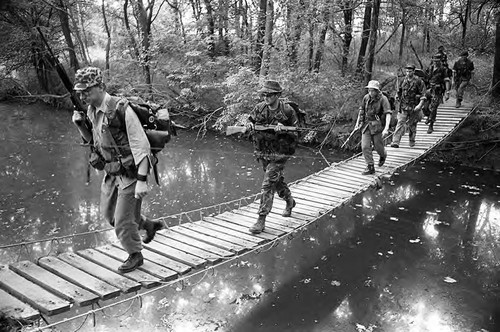 Survival school students cross a bridge, Liberal, 1982