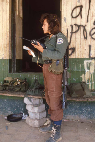 Woman guerrilla with radio, San Agustín, 1983