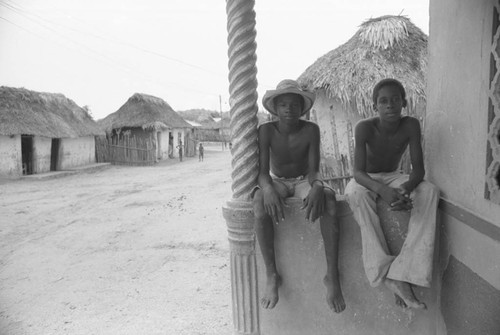 Two boys sitting on a wall, San Basilio de Palenque, 1976