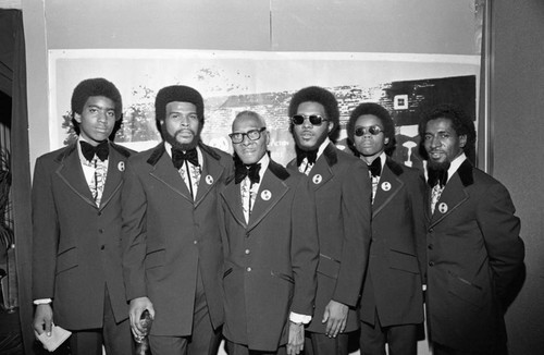 Men posing at formal event