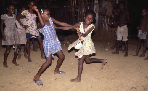 Girls boxing outdoors, San Basilio de Palenque, 1976