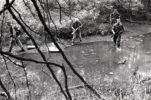 Survival school students participate in an obstacle course, Liberal, 1982