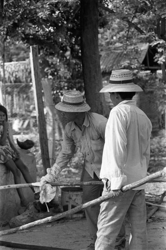 Operating the oven, La Chamba, Colombia, 1975