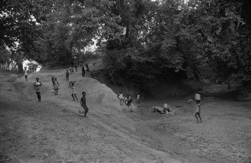 Women and children collecting water at a river, San Basilio de Palenque, 1976