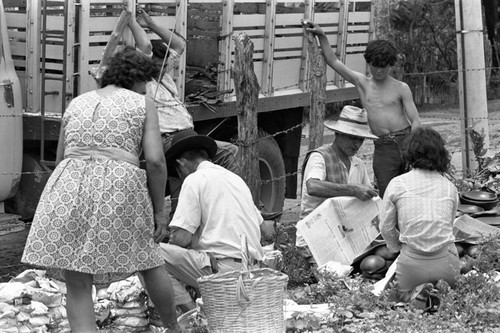 Wrapping clay pieces, La Chamba, Colombia, 1975