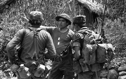 Col. Jorge Adalberto Cruz Reyes instructs his soldiers, Morazán, 1983